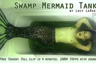 Lucy LaRue plays the role of a Swamp Mermaid Tank in a super-hot solo skylarking